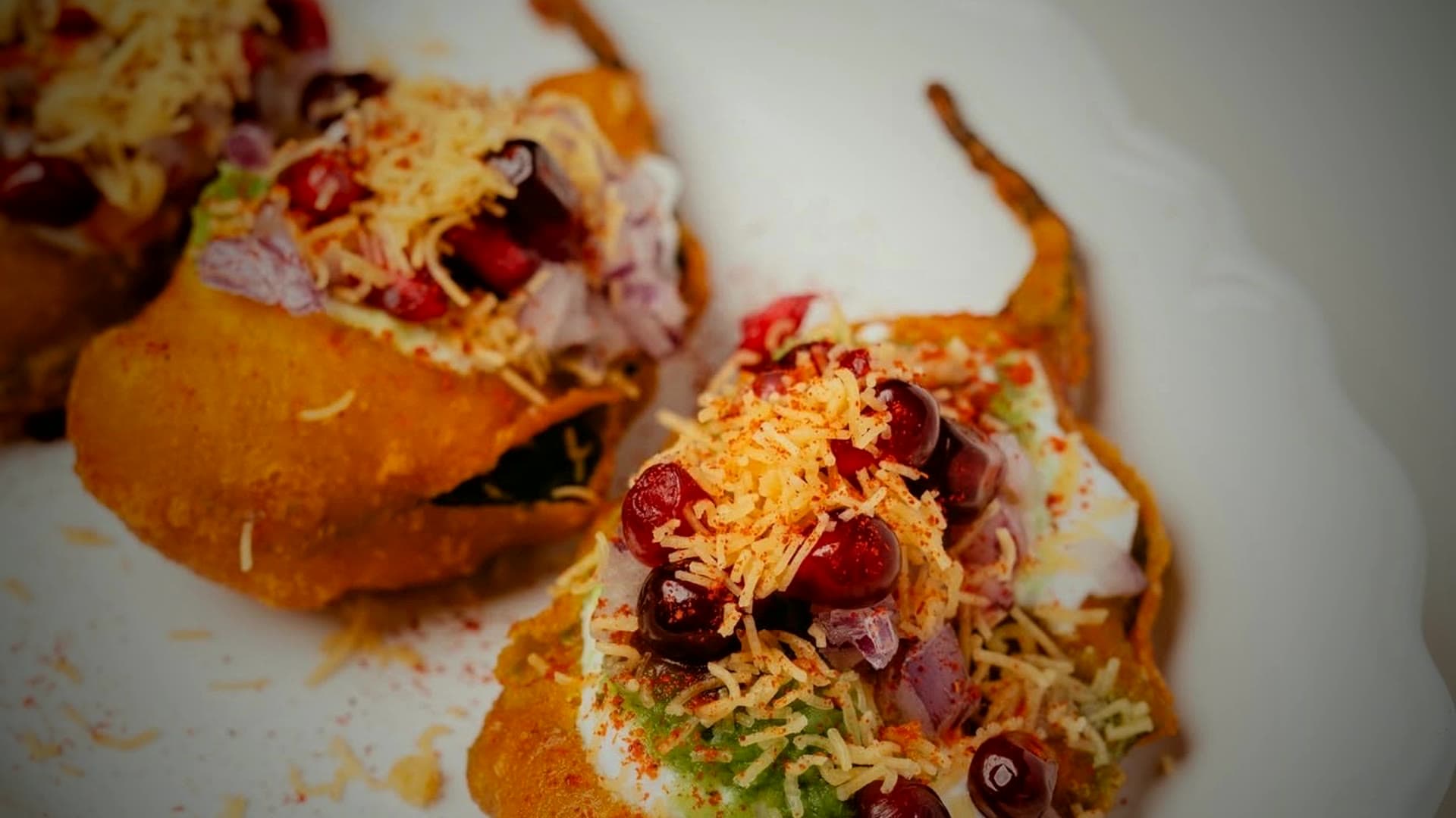 A vibrant palak chaat — crisp spinach leaves with chutneys and yogurt
