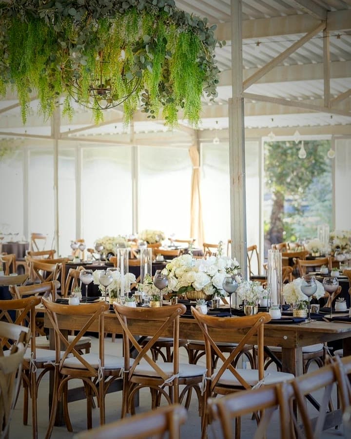 A tented Indian wedding reception set by Ashoka